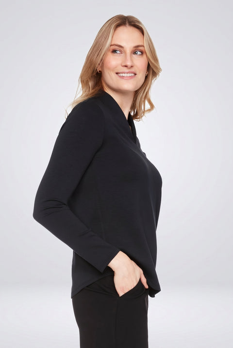 Woman wearing the Butter V-Neck Top in Black, side view.