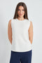 Woman wearing the Butter sleeveless shell top in Ivory