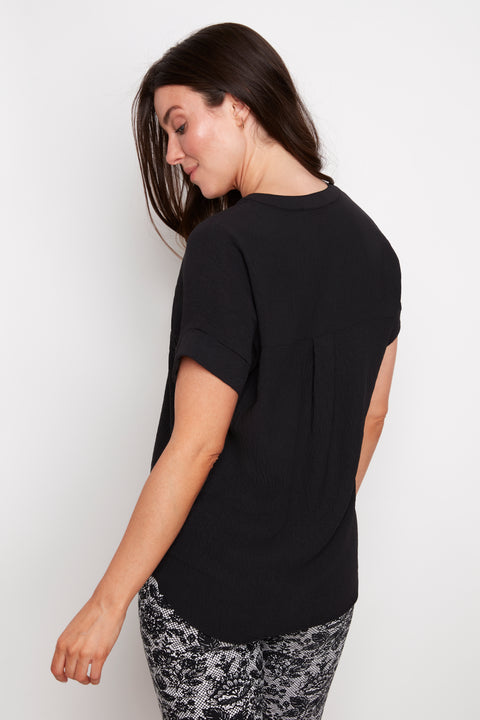 Back view of model wearing UP! Air Flow Short Sleeve Top in Black.