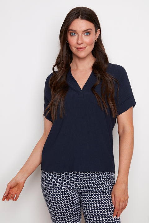 Model wearing UP! Air Flow Short Sleeve Top in Navy, front view.