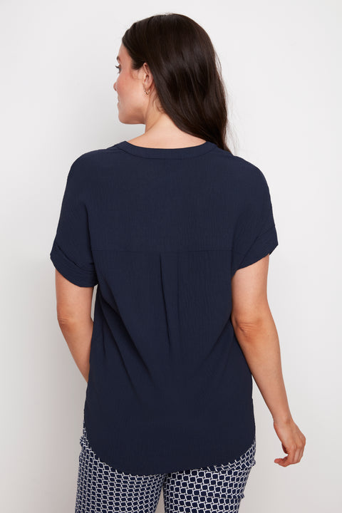 Back view of model wearing UP! Air Flow Short Sleeve Top in Navy.