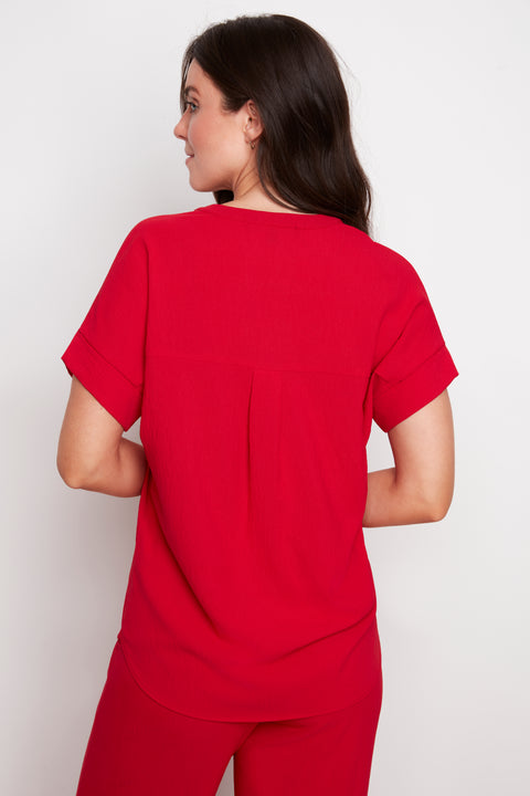 Back view of model wearing UP! Air Flow Short Sleeve Top in Strawberry.