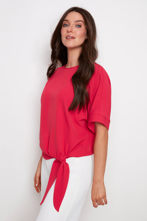 Model wearing UP! Vegan Silk Tie Knot T-Shirt in Dahlia Red, front view.