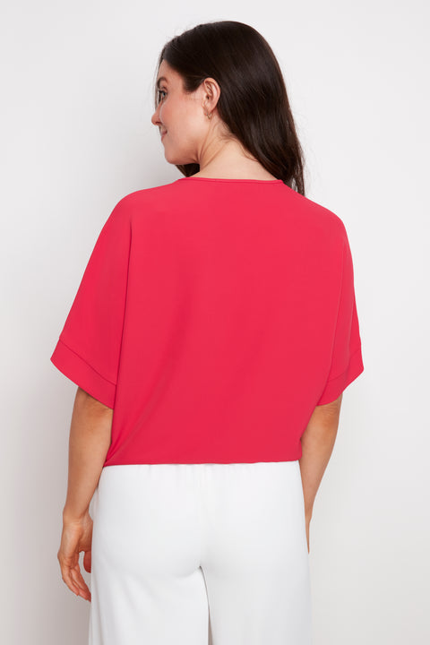 Back view of model wearing UP! Vegan Silk Tie Knot T-Shirt in Dahlia.