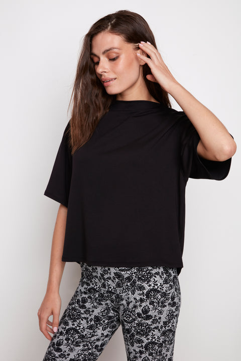 Model wearing UP! Provence Short Sleeve Top in Black, front view.