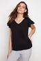 Model wearing UP! Provence V-Neck Ruffle Sleeve Top in Black, front view.