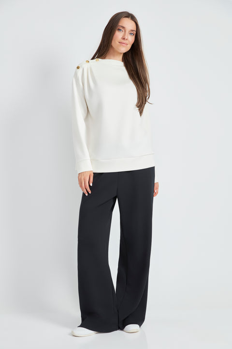 Woman wearing the Butter 3-Button Top in Ivory, front view.