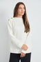 Woman wearing the Butter 3-Button Top in Ivory, front view.