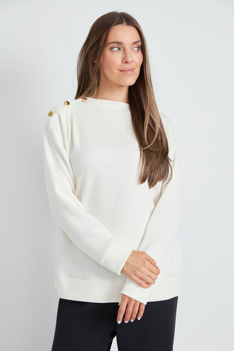 Woman wearing the Butter 3-Button Top in Ivory, front view.