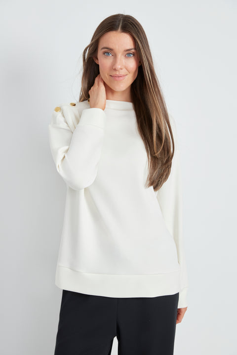 Woman wearing the Butter 3-Button Top in Ivory, front view.