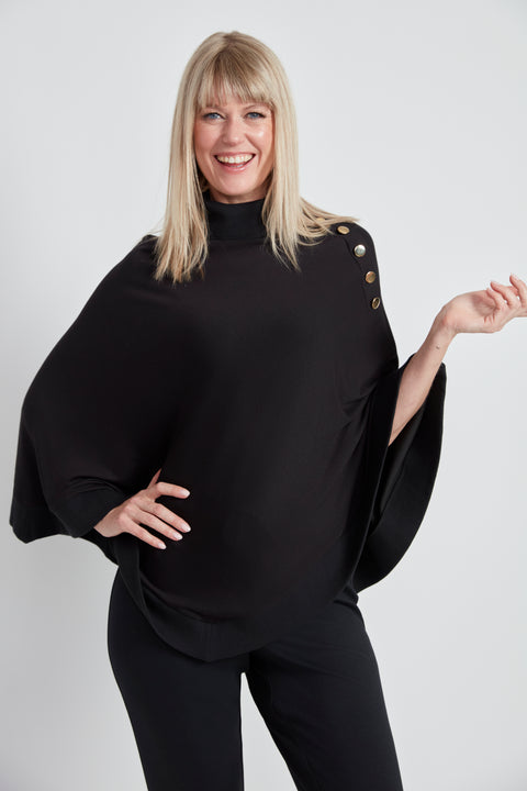 Woman wearing the Butter Cape in Black.