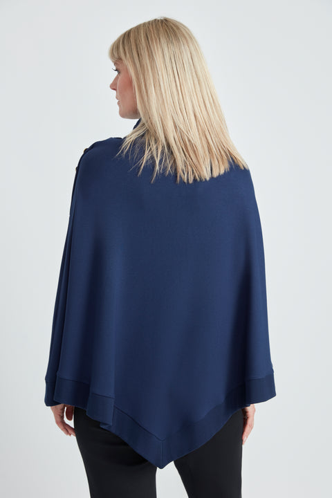 Woman wearing the Butter Cape in Harbor Blue, back view.
