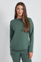 Woman wearing the French Terry Raw Edge Top in Ivy Green.
