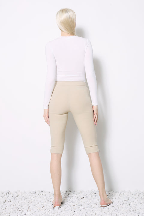 Back view of model wearing UP! Techno Vented Bermuda Short in Stone.
