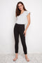 Model wearing UP! Textured Techno Petal-Slit Ankle Pant in Black Loom, front view.