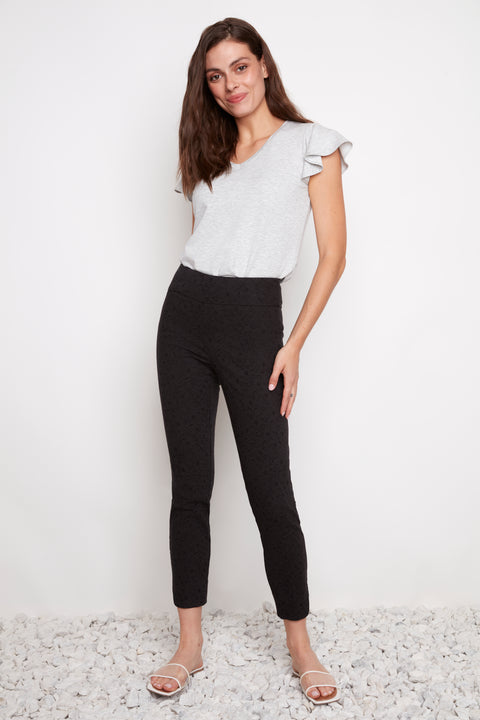 Model wearing UP! Textured Techno Petal-Slit Ankle Pant in Black Loom, front view.