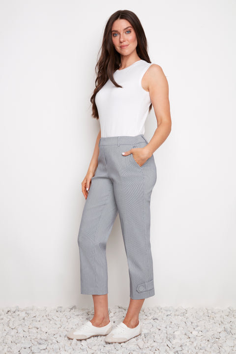 Side view of model wearing UP! Navy Stripe Techno Button-Tab Crop Pant in Navy/White Stripe with button-tab cuff detail.