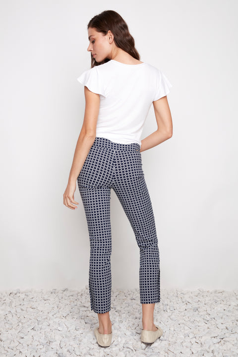 Back view of model wearing UP! Coastal Techno Button-Vent Ankle Pant in Blue Coastal print.