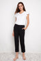 Model wearing UP! Compression Techno Button-Cuff Straight Leg Crop Pant in Black, front view.