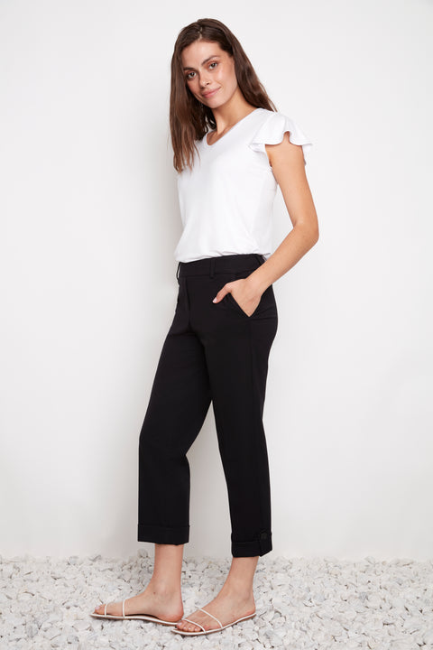 Side view of model wearing UP! Compression Techno Button-Cuff Straight Leg Crop Pant in Black with button-tab cuff detail.