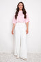 Model wearing UP! Vegan Silk Wide-Leg Full-Length Pant in Cream, front view.