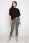 Model wearing UP! Lacey Techno Petal-Slit Ankle Pant in Black & White Lacey print, front view.