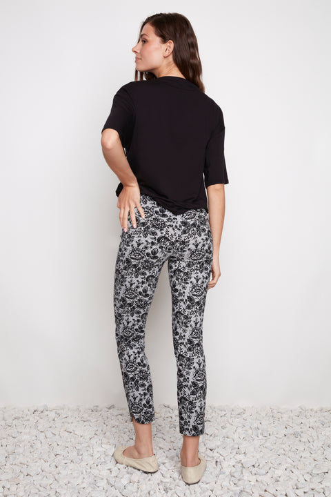 Back view of model wearing UP! Lacey Techno Petal-Slit Ankle Pant in Lacey print.