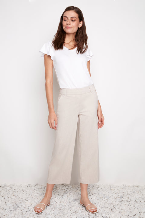 Model wearing UP! Linen Effect Techno Wide Leg Crop Pant in Linen, front view.