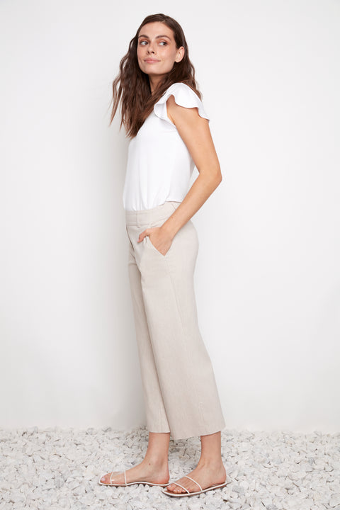 Side view of model wearing UP! Linen Effect Techno Wide Leg Crop Pant in Linen with angled pocket detail.