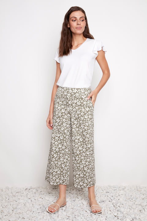 Model wearing UP! Wild Daisy Techno Wide Leg Crop Pant in Wild Daisy print, front view.