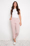 Model wearing UP! Pink Stripe Techno Button-Tab Crop Pant in Pink/White Stripe, front view.