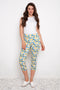 Model wearing UP! Lemon Blossom Techno Vented Capri Pant in Lemon Blossom print, front view.