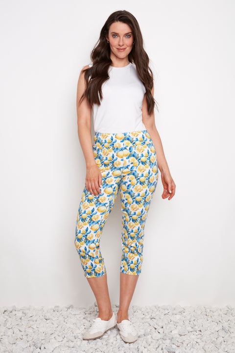 Model wearing UP! Lemon Blossom Techno Vented Capri Pant in Lemon Blossom print, front view.