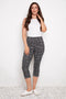 Model wearing UP! Bloom Techno Petal Vent Capri Pant in Bloom print, front view.