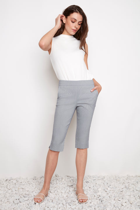 Model wearing UP! Navy Stripe Techno Vented Bermuda Short in Navy/White Stripe, front view.