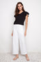 Model wearing UP! Techno Core Wide Leg Pant in White, front view.