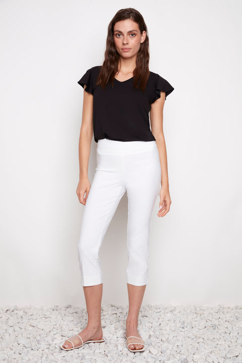 Model wearing UP! Techno Core Capri Pant in White, front view.