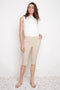 Model wearing UP! Techno Core Bermuda Short in Sand, front view.