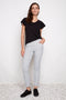 Front view of model wearing UP! Casa Soft Stream Ankle Pant in Casa print.
