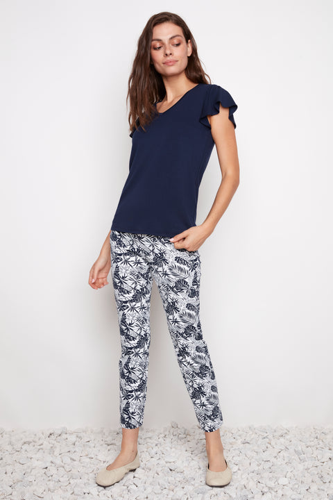 Model wearing UP! Cabo Soft Stream Ankle Pant in Navy Cabo print, front view.