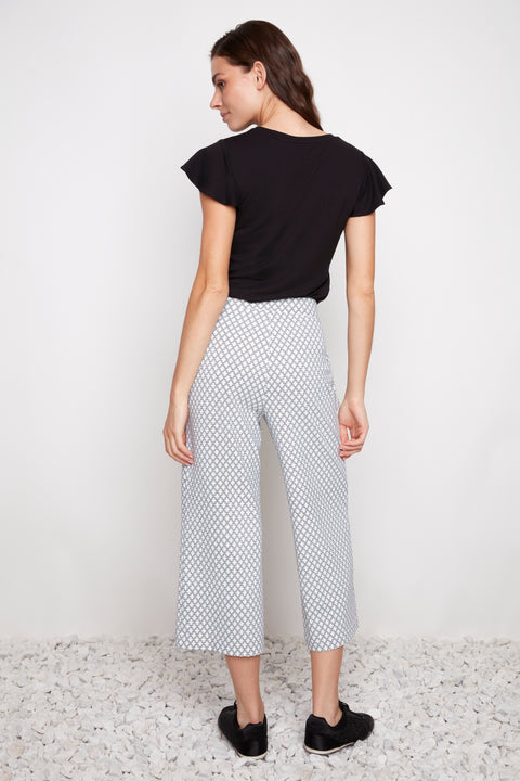 Back view of model wearing UP! Casa Soft Stream Wide Leg Cropped Pant in Casa print.