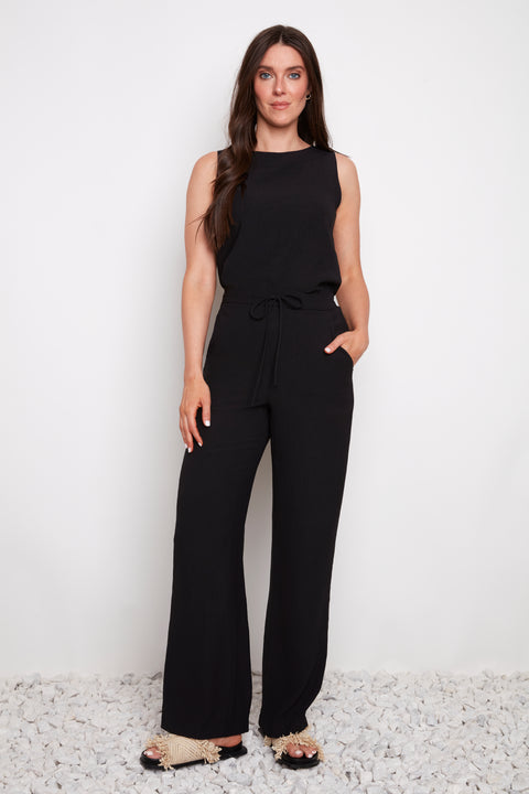 Model wearing UP! Air Flow Wide Leg Pant in Black, front view.
