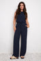 Model wearing UP! Air Flow Wide Leg Pant in Navy, front view.