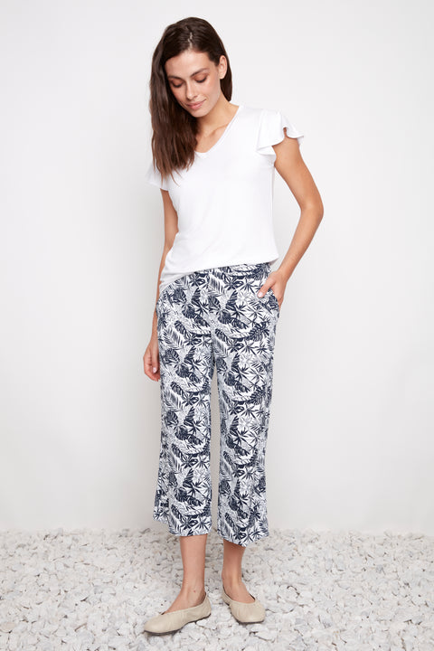 Model wearing UP! Cabo Soft Stream Wide Leg Cropped Pant in Cabo print, front view.