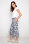 Side view of model wearing UP! Cabo Soft Stream Wide Leg Cropped Pant in Cabo print with wide-leg silhouette.