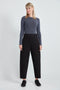 Woman wearing the Ponte Barrel-Leg Pant in Black.
