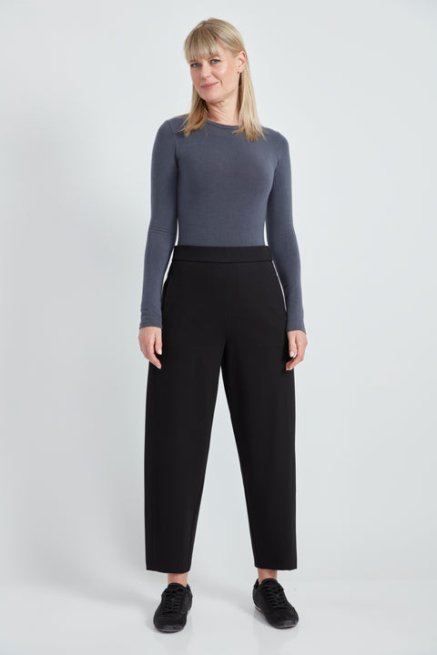 Woman wearing the Ponte Barrel-Leg Pant in Black.