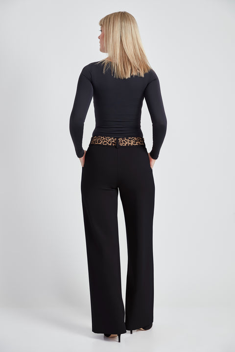 Woman wearing the Ponte Tie-Sash Wide Leg Pant in Black, back view.
