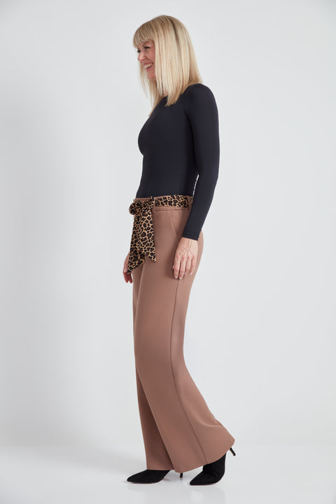 Woman wearing the Ponte Tie-Sash Wide Leg Pant in Biscuit, side view.