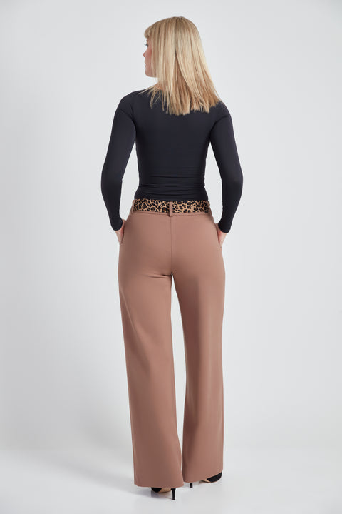 Woman wearing the Ponte Tie-Sash Wide Leg Pant in Biscuit, back view.